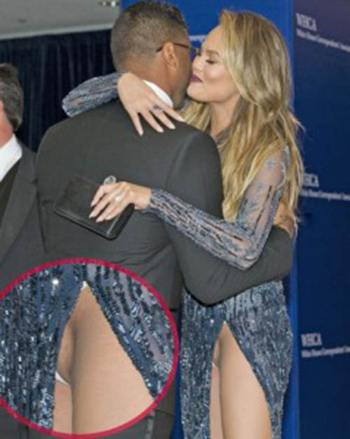 Chrissy Teigen flashes her naked pussy